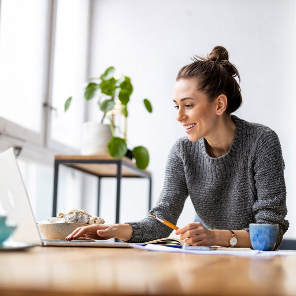 young woman signing up for a small business loan